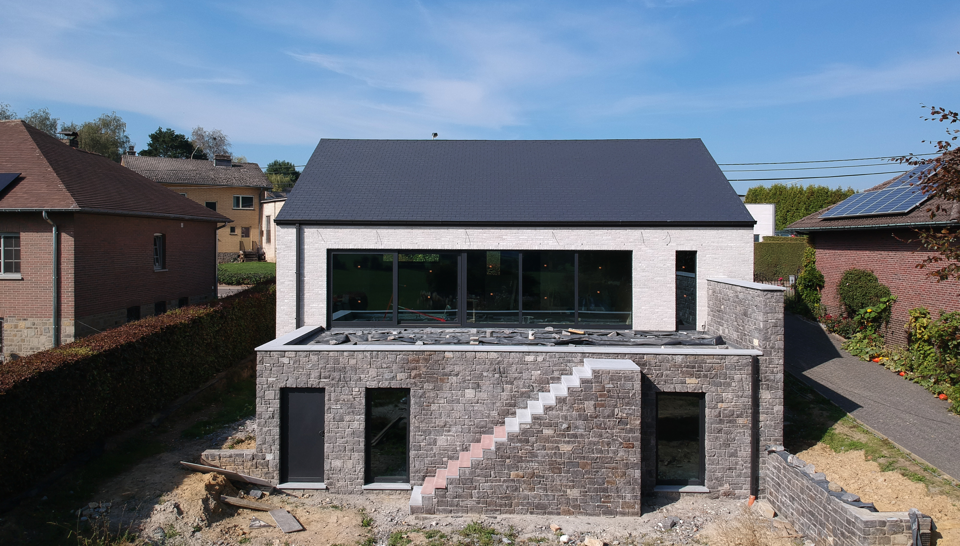 Villa with natural stone Lontzen - view from behind - Danphil-Construction builder
