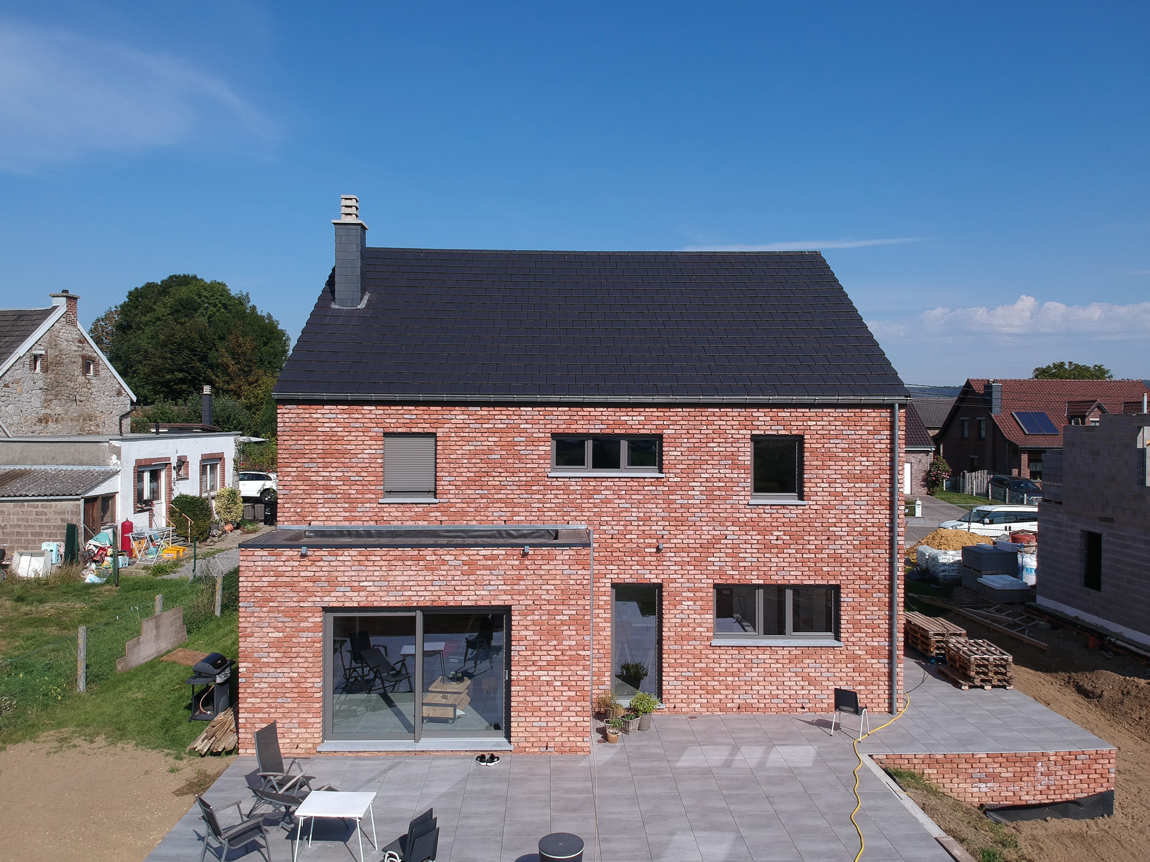 Villa mit Naturstein Bleiberg - Hinteransicht von nahem - Danphil-Construction Contractor