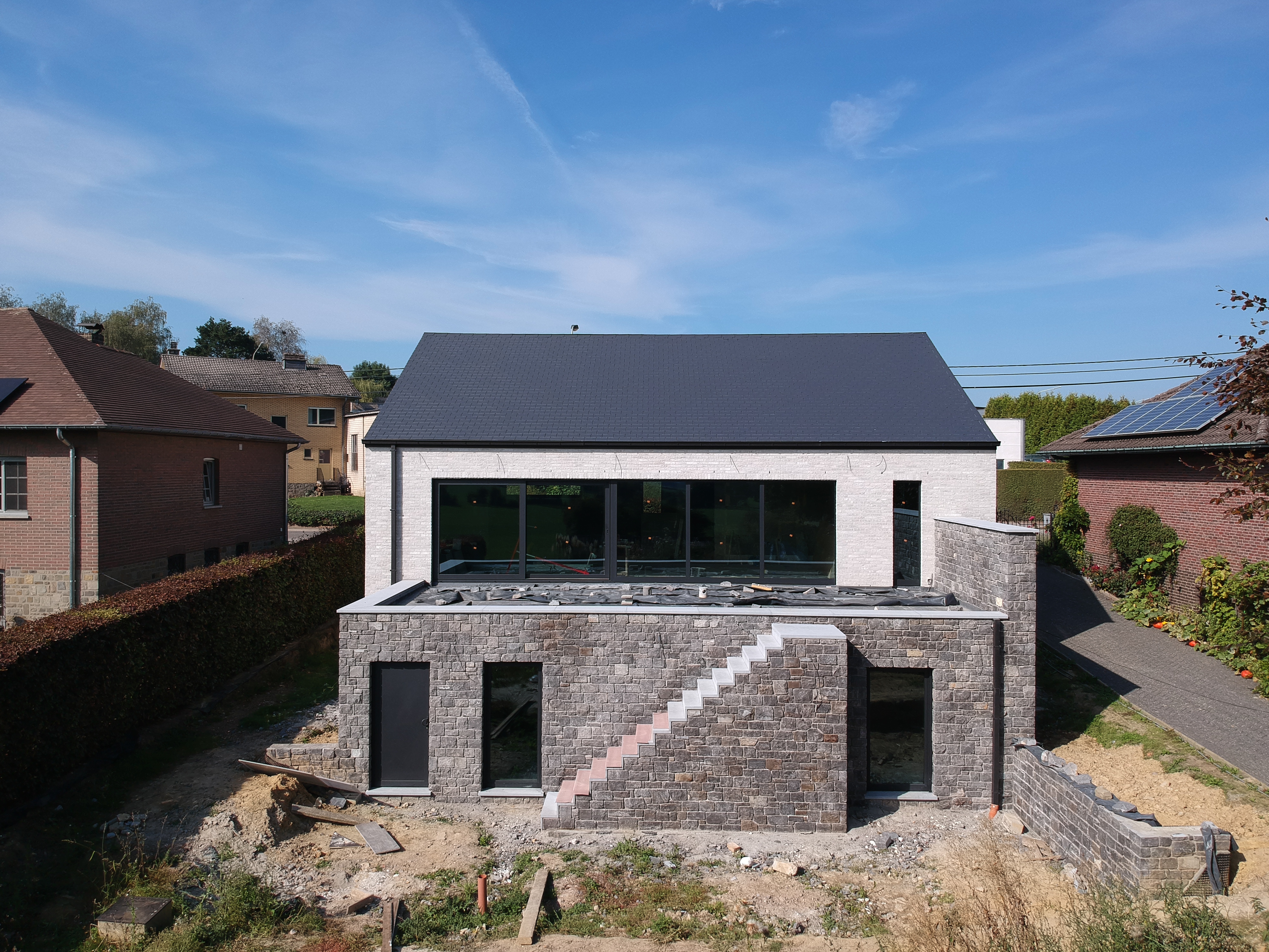 Villa with natural stone Lontzen - Back view central - Danphil-Construction Contractor