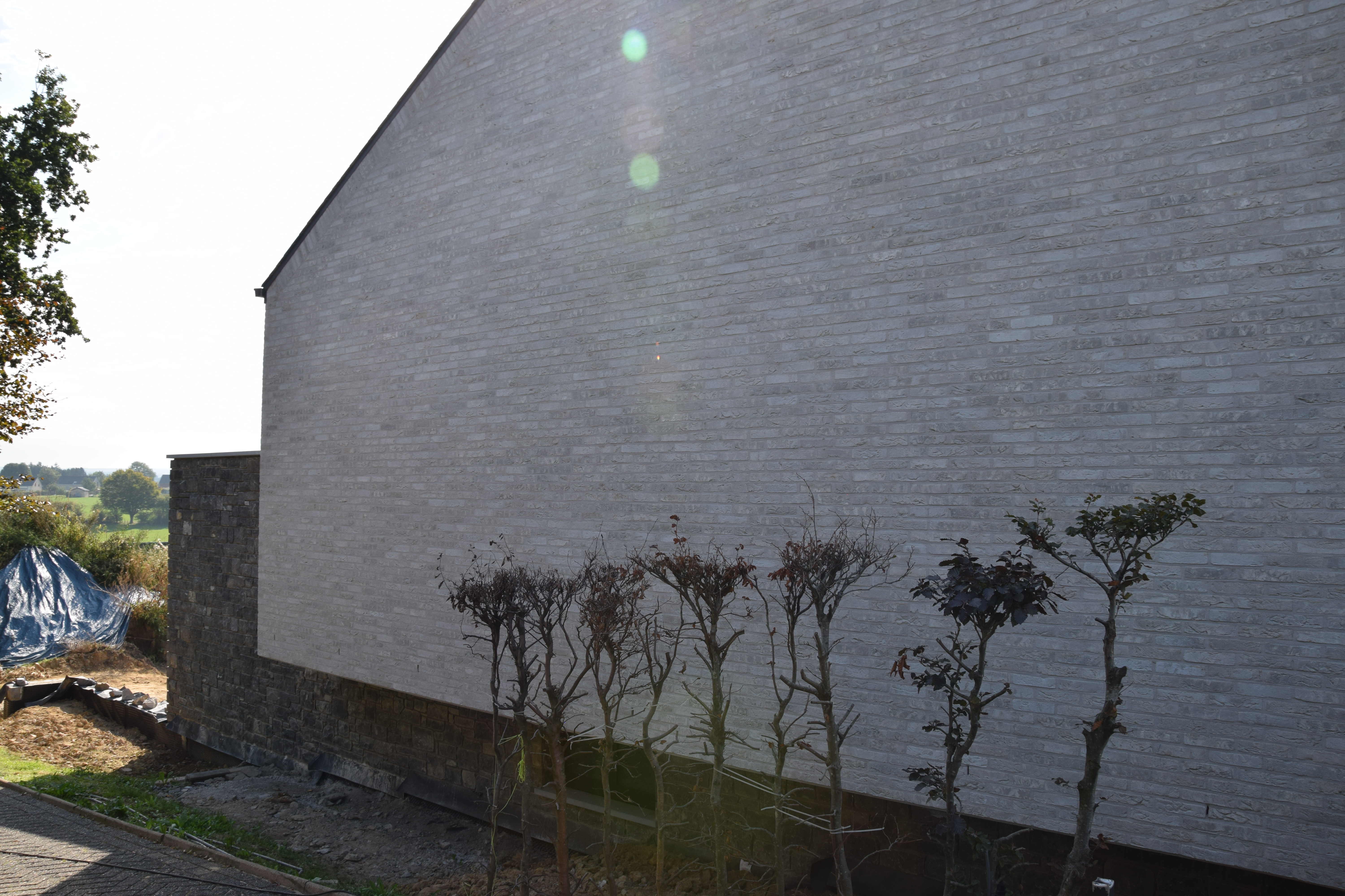 Villa with natural stone Lontzen - Side view left - Danphil-Construction Contractor