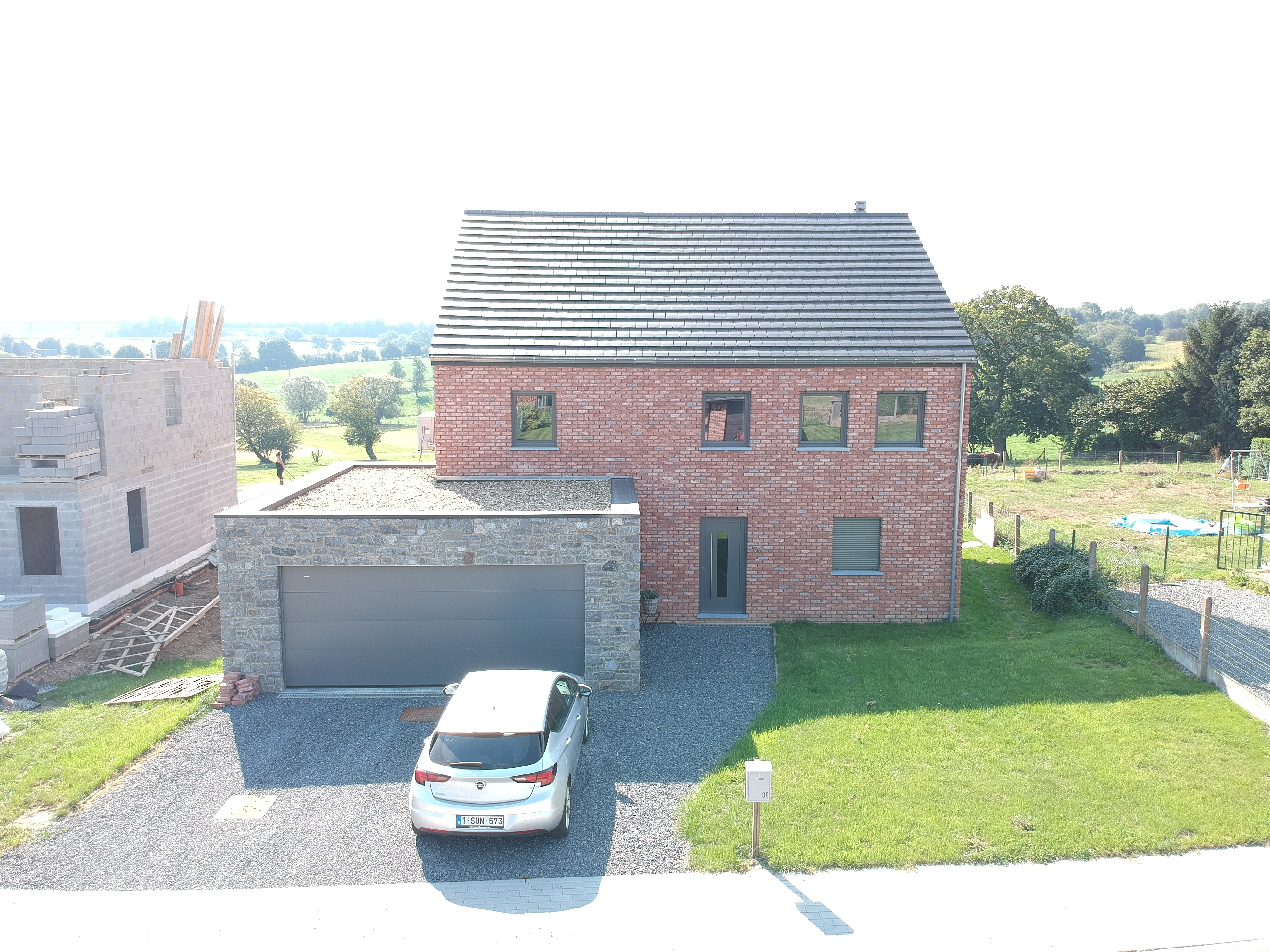 Villa mit Naturstein Bleiberg - Vorderansicht (cover) - Danphil-Construction Contractor