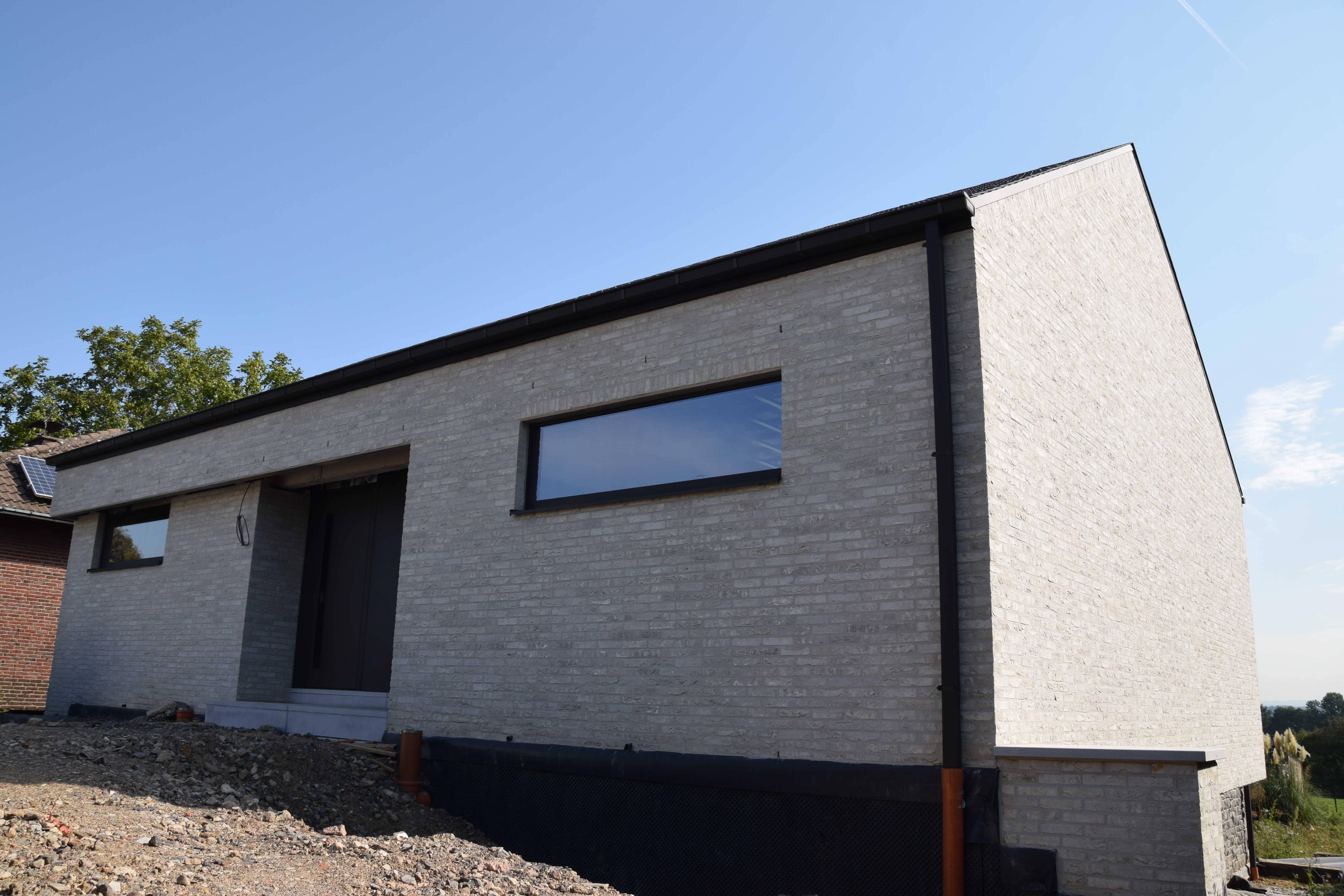 Villa with natural stone Lontzen - Front view right (cover) - Danphil-Construction Contractor